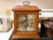 (K) WOOD CASE, GLASS FRONT MANTEL CLOCK; WESTMINSTER CHIME PRINTED ON GOLD TONE FACE. CONDITION