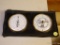 (K) LEATHER DOUBLE-FACED THERMOMETER/ BAROMETER; BLACK IN COLOR, RECTANGULAR, 2 HOOKS AT TOP FOR