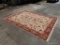 (GAR) LARGE ORIENTAL RUG IN GOLD, RED, AND BROWN. APPROXIMATELY 8? X 10?