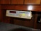 (GAR) GENERAL ELECTRIC SPACEMAKER UNDER-CABINET RADIO, CLOCK, WITH LIGHT. OFF WHITE IN COLOR WITH