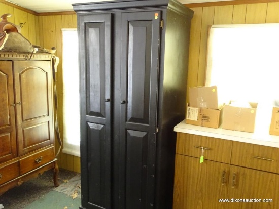 (SUN) WARDROBE; BLACK PAINTED WOOD CABINET WITH 2 FRONT PANELED DOORS AND ROUND WOODEN KNOBS.