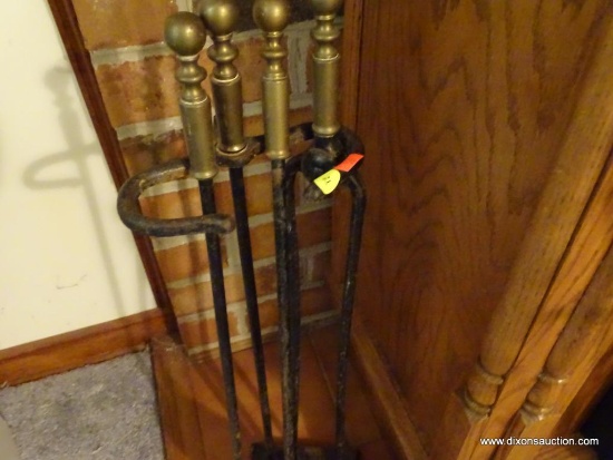 (LR) FIREPLACE SET; BRASS HANDLES ON IRON TOOLS IN A SQUARE BASE, TOTAL OF 4 PCS INCLUDING STAND.