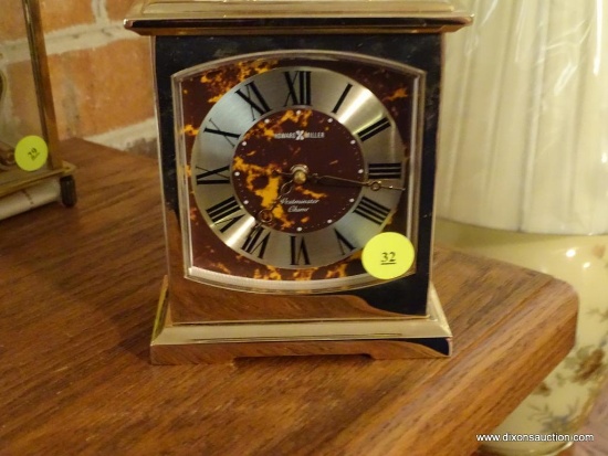 (LR) HOWARD MILLER BRASS MANTEL CLOCK; VERY HEAVY, RECTANGULAR WITH SMALL HANDLE AT TOP, MODEL