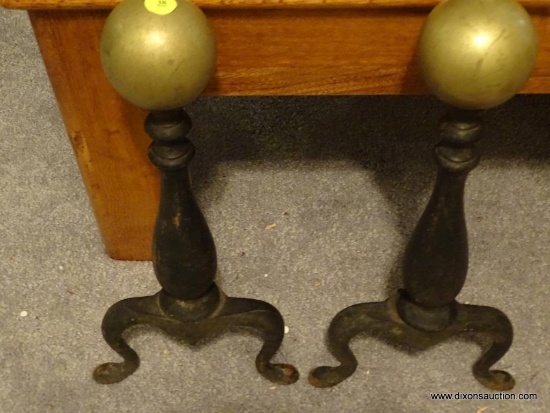 (LR) PAIR OF WROUGHT IRON FIREPLACE ANDIRONS WITH BRASS BALL TOPS AND CURVED LEGS; EACH MEASURES 16"