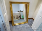 (BR2) MIRROR; BEAUTIFULLY FRAMED IN FLORAL GOLD-TONE TRIM, THIS MIRROR IS IN EXCELLENT SHAPE AND