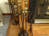 (LR) FIREPLACE SET; BRASS HANDLES ON IRON TOOLS ON A ROUND BASE, TOTAL OF 6 PCS INCLUDING STAND.