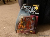 (LR) STAR TREK ACTION FIGURE ?KANG?. FROM THE WARP FACTOR SERIES 4. BRAND NEW IN THE BLISTER