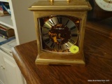 (LR) HOWARD MILLER BRASS MANTEL CLOCK; VERY HEAVY, RECTANGULAR WITH SMALL HANDLE AT TOP, MODEL