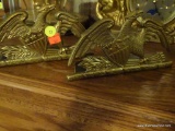 (LR) BRASS FEDERAL EAGLE AND SHIELD BOOKENDS; PAIR SITTING ON MANTLE. EACH MEASURES ABOUT 9
