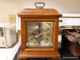 (K) WOOD CASE, GLASS FRONT MANTEL CLOCK; WESTMINSTER CHIME PRINTED ON GOLD TONE FACE. CONDITION