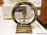 (K) KIENINGER AND OBERGFELL ROUND BRASS MANTEL CLOCK; KUNDE ELECTRONICS PRINTED ON GLASS FACE.