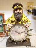 (K) OLD SAILOR CLOCK MADE BY MASTERCRAFTERS CLOCK CO., MODEL #722. YELLOW/BROWN WITH ROUND FACE SET