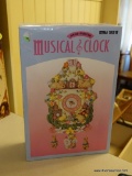 (K) HAND PAINTED MUSICAL CLOCK; IN ORIGINAL BOX, BATTERY OPERATED. MADE BY II INC., MODEL #59217,