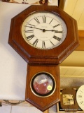 (K) OCTAGON TOP WOODEN WALL CLOCK BY VERICHRON; WESTMINSTER CHIME, PENDULUM TUCKED INSIDE LOWER