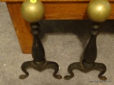 (LR) PAIR OF WROUGHT IRON FIREPLACE ANDIRONS WITH BRASS BALL TOPS AND CURVED LEGS; EACH MEASURES 16