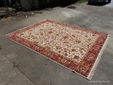 (GAR) LARGE ORIENTAL RUG IN GOLD, RED, AND BROWN. APPROXIMATELY 8? X 10?