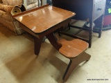 (GAR) MAHOGANY STUDENTS DESK WITH BUILT IN CHAIR. HAS LIFT TOP THAT OPENS TO REVEAL STORAGE. WOULD