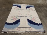 (GAR) AREA RUG IN IVORY AND BLUE. APPROXIMATELY 6? X 9?
