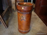 (GAR) LEATHER CYLINDRICAL CANISTER WITH HANDLE AND WORN SIDE REGAL CREST DETAIL. POSSIBLY USED FOR A