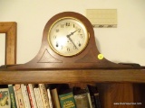 (LR) MANTEL CLOCK BY SETH THOMAS; RICH AND DARK WOOD IN TRADITIONAL ARCH PATTERN, CARVED TRIM ON