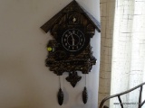 (DR) CUCKOO CLOCK; BLACK PLASTIC CUCKOO-STYLE CLOCHE WITH GOLD PAINTED DETAIL. REAL WORKING BIRDIE