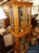 (R4) MAPLE CURIO CABINET WITH GLASS FLOATING SHELVES AND LIGHTED INTERIOR; DENTIL MOLDING ON TOP