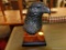 (R5) BLACK RESIN BALD EAGLE BUST FIGURINE; SITS ATOP A BROWN MARBLED SQUARE BASE. STANDS 7 IN TALL.