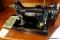 (R4) VINTAGE SINGER PORTABLE ELECTRIC SEWING MACHINE; MODEL #221-1, BLACK FINISH WITH PRISTINE GOLD