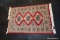 (R5) SMALL PAKISTAN AREA RUG; HAND KNOTTED, 100% WOOL. RED WITH TAN, GREY-BLUE, AND BLACK BORDER AND