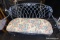 (R6) WROUGHT IRON LOVESEAT WITH FLORAL CUSHION; LIGHT BLUE-GREY IN COLOR, LATTICE PATTERNED BACK,
