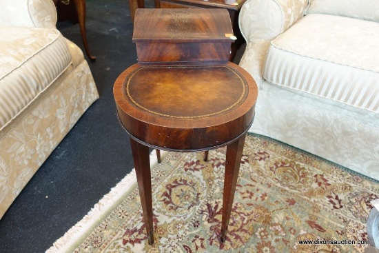 (WIN) ROUND MAHOGANY SIDE TABLE WITH STORAGE TRAY; LEATHER TOOLED TOP, 4 TAPERING LEGS. ELEVATED TOP