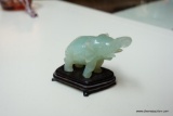 (R2) GREEN JADE MARBLE ELEPHANT ON SMALL ROSEWOOD STAND; TOTAL LENGTH IS 3.75 IN. HEIGHT IS 2.5 IN.