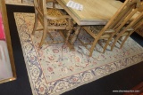 (R2) TURKISH AREA RUG BY BHADRA; SAGE GREEN WITH TAN, RED, AND NAVY BLUE BORDER AND FLORAL ALL-OVER