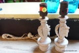 (R2) PAIR OF VINTAGE MARBLE LAMP BASES; OFF WHITE WITH CARVED FLOWERS ALONG POST WITH ROUND BASES.