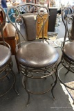(R2) BLACK IRON AND UPHOLSTERED BARSTOOL; SCROLLED BACK RAILS WITH BLACK VINYL BACK PANELS AND ROUND