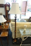 (R3) FLOOR LAMP; IVORY LINEN BELL SHAPED LAMPSHADE WITH WOODEN POST AND BLACK PAINTED 4-LEGGED BASE.