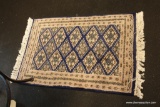(R2) PAIR OF SMALL TURKISH STYLE RUGS; NAVY BLUE WITH TAN BORDER AND PATTERN AND CREAM COLORED