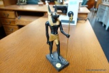 (R3) EGYPTIAN FIGURINE DEPICTING ANUBIS, THE GOD OF THE UNDERWORLD STANDING ON A BLACK BASE; GOLD