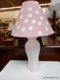 (R4) WHITE TABLE LAMP WITH POLKA DOTTED LAMPSHADE; PINK AND WHITE SHADE, STANDS 24 IN TALL.