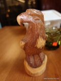 (R4) CARVED WOODEN EAGLE FIGURINE; STANDS 9 IN TALL.