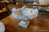 (R5) WHITE ALABASTER PEDESTAL BOWL WITH BIRDS ALONG THE RIM; MEASURES 7 IN DIAMETER AND 5 IN TALL.