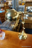 (R5) BRASS DESK LAMP WITH ADJUSTABLE NECK AND DOME SHAPED SHADE; STANDS ABOUT 21 IN TALL.