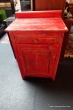 (R4) RED RUSTIC FARMHOUSE CABINET; BACK GALLERY LEDGE; SINGLE DRAWER WITH WOODEN PULL OVER A