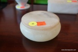(R1) WHITE ALABASTER ROUND LIDDED BOX; FLAT LID HAS CARVED LEAF PATTERN AROUND EDGE AND ON SIDE OF