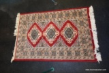 (R5) SMALL PAKISTAN AREA RUG; HAND KNOTTED, 100% WOOL. RED WITH TAN, GREY-BLUE, AND BLACK BORDER AND