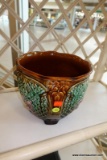 (WIN) GREEN AND BROWN JARDINIERE/PLANTER; THIS LOVELY PLANT HAS A BEAUTIFUL FLORAL DESIGN FEATURING