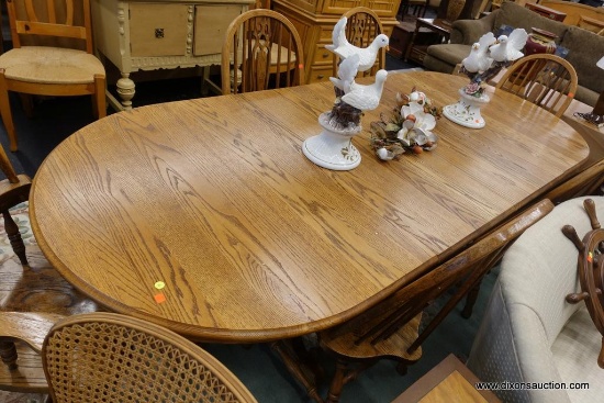 (WIN) LARGE OAK DINING ROOM TABLE; 2 LEAF DINING ROOM TABLE FEATURES 2 SIZELY CARVED WOODEN