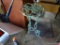 (GAR) WROUGHT IRON PLANT STAND; ROUND TOP, 3 LEGS, STANDS ABOUT 28 IN TALL, HAS A GREEN WEATHERED
