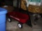 (GAR) SMALL METAL RED RADIO FLYER WAGON WITH HANDLE; MEASURES 20.5 IN LONG.