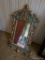 (BAS2) CHERUB GOLD AND GREEN TONED MIRROR; ORNATE MIRROR WITH GOLD TONED SCROLLS AND AN ANGEL WITH A